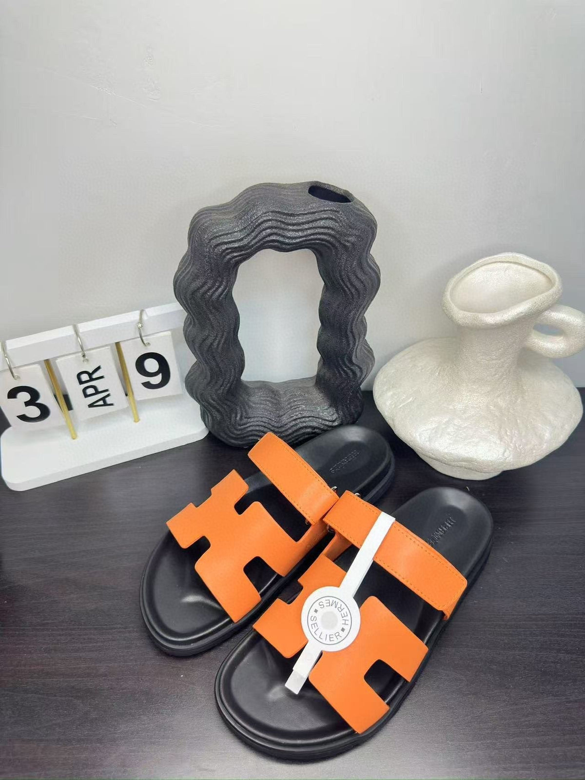 Hermès Orange Interwoven Slide Sandals - Orange and Black